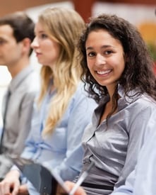 Businesswoman smiling during a presentation- 530x660 px