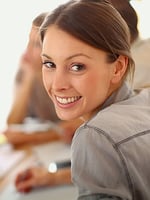 Portrait of smiling working girl in meeting_cropped